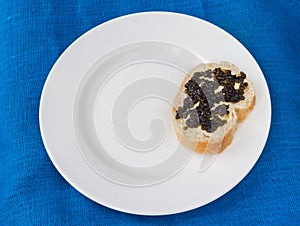 A sandwich with black caviar