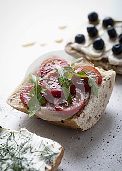 Sandwich Bread with cherry tomatoes and rucola