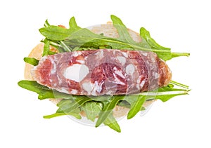 sandwich with bread, cured sausage and arugula