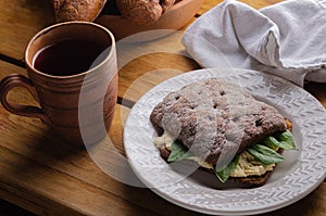 Sandwich bruschetta made from whole grain bread with cheese and spinach. Healthy snack, healthy food