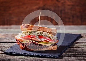 Sandwich with cereals bread with lettuce,ham, prosciutto