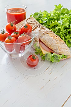 Sandwich with cheese abd ham, salad and tomatoes