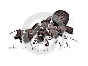 Sandwich chocolate cookies with a sweet cream and cracked isolated on white background