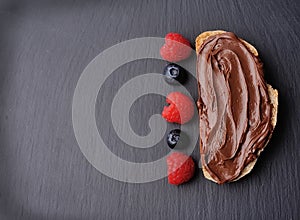Sandwich with chocolate paste with berry