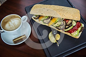 sandwich with coffee on black and broun