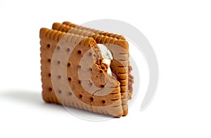 Sandwich cookies, chocolate and vanilla cream filled biscuits isolated on white background