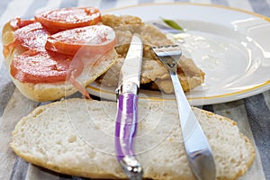 Sandwich with cutlet and tomatoes