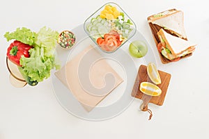 Sandwich on cutting board on the table in the bright kitchen. Lunch. Sandwich with lettuce. Healthy eating concept