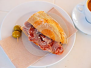 Sandwich with delicious delicaty dried sausage Fuet