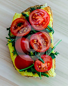 Sandwich detail. Sandwich with eggs rucola and tomatoes