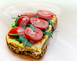 Sandwich detail. Sandwich with eggs rucola and tomatoes