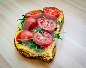 Sandwich detail. Sandwich with eggs rucola and tomatoes