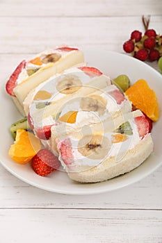 Sandwich filled with fruit and sweetened whipped cream