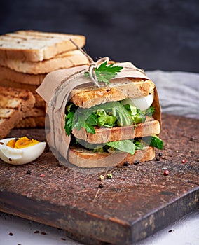 sandwich of French toast and lettuce leaves and boiled egg