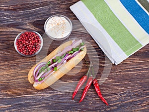 Sandwich with fresh vegetables on wooden board