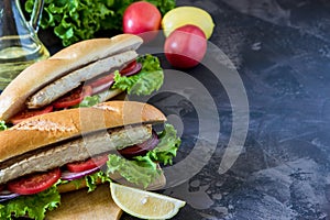Sandwich with fried fish and vegetables. Balik ekmek - turkish f