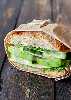 Sandwich with green salad, avocado, cucumber and cheese. Healthy eating. Vegetarian food. Breakfast