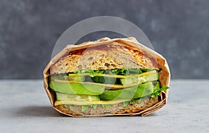 Sandwich with green salad, avocado, cucumber and cheese. Healthy eating. Vegetarian food. Breakfast