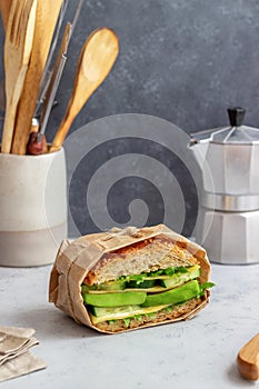 Sandwich with green salad, avocado, cucumber and cheese. Healthy eating. Vegetarian food. Breakfast