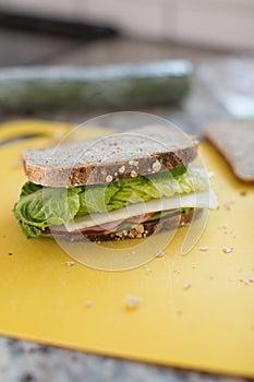 Sandwich with ham, cheese, cucmber and lettuce