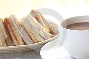 Sandwich ham cheese with hot chocolate