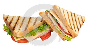 Sandwich with ham, cheese, tomato, lettuce and toasted bread isolated on a white background