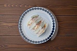 sandwich with ham egg isolated on table