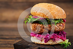 Sandwich hamburger with juicy burgers, red cabbage