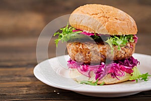 Sandwich hamburger with juicy burgers, red cabbage