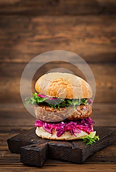 Sandwich hamburger with juicy burgers, red cabbage