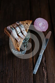 Sandwich with herring and vodka