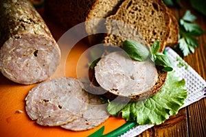 A sandwich with homemade sausage and rye bread