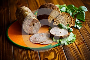 A sandwich with homemade sausage and rye bread