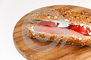 Sandwich with hot dog tomato white cheese cereals