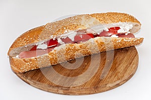 Sandwich with hot dog tomato white cheese cereals