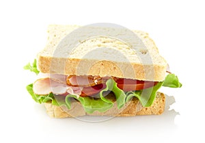 Sandwich with lettuce,tomato,cold cuts on white-bird`s eye view