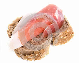 Sandwich made with rye bread and Parma ham on isolated background