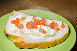 sandwich with red caviar on a plate