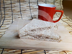 Sandwich with red cup background in morning