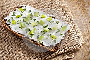 Sandwich of rye bread and curd cheese, dill and chives