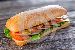 Sandwich with salmon and vegetables