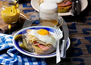 Sandwich with sauerkraut , ham and fried eggs