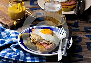 Sandwich with sauerkraut , ham and fried eggs