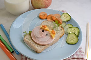 Sandwich with sausage, decoration  organic n a plate eating