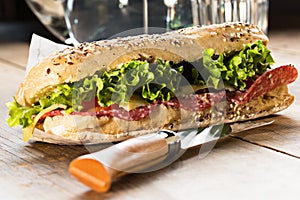 Sandwich with sesame seeds and salad