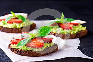 Sandwich with strawberry on white paper