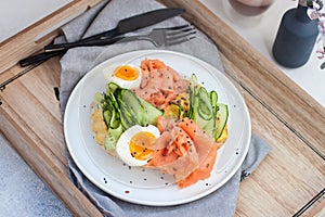 Sandwich with toast bread, smoked salmon, cream cheese, sliced cucumber and boiled eggs