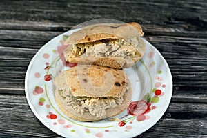 A sandwich of Traditional plain tahini halva or Halawa Tahiniya as basic tahini and sugar base inside a mini traditional Egyptian