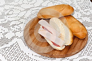 Sandwich turkey smoked ham tomato ketchup wooden board