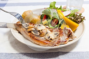 Sandwich in white dish on wooden table